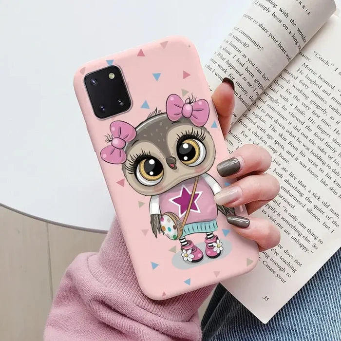 a girl with a pink bow and a pink heart phone case