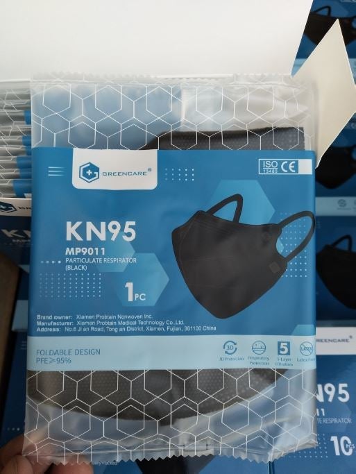 Greencare black KN95 face mask in individual wrapper