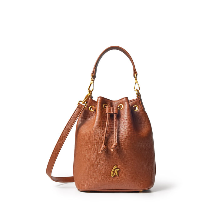 Medium brown pebble-textured bucket bag with gold hardware, drawstring closure, and a top handle.
