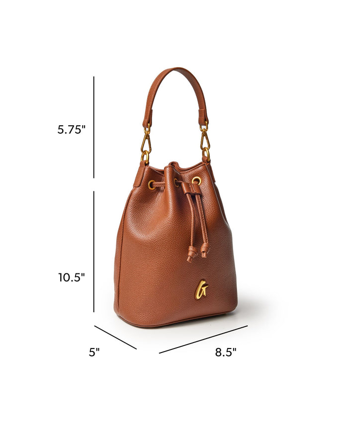 Medium brown pebble bucket bag with gold accents, featuring a drawstring closure and adjustable shoulder strap.