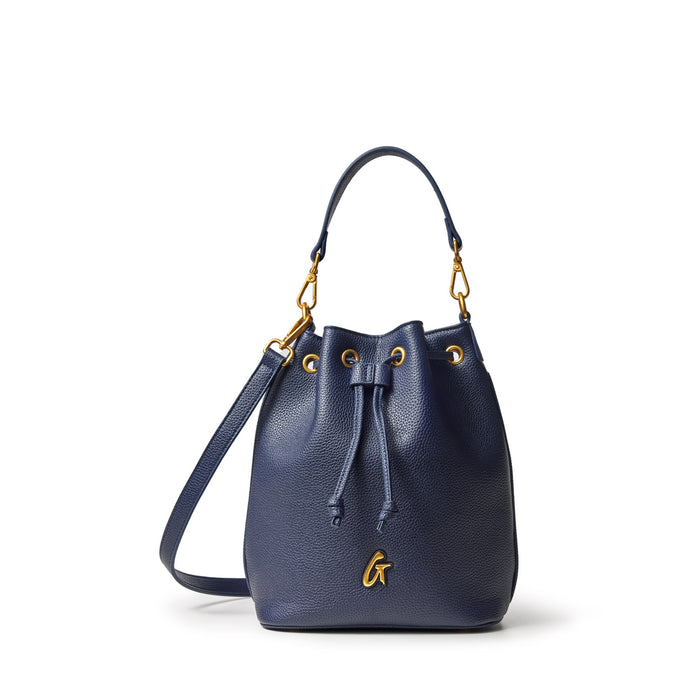 Medium navy pebble leather bucket bag with gold hardware, drawstring closure, and adjustable strap.