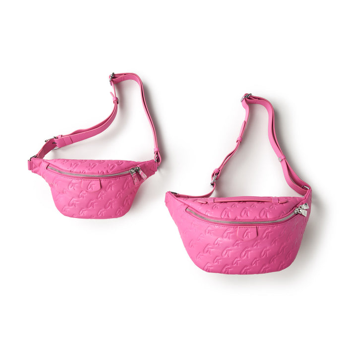 Two pink mini monogram fanny packs with embossed logo pattern, silver zippers, and adjustable straps on a white background.