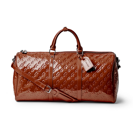 Shiny brown monogram duffle bag with dual handles and detachable shoulder strap, perfect for stylish travel.