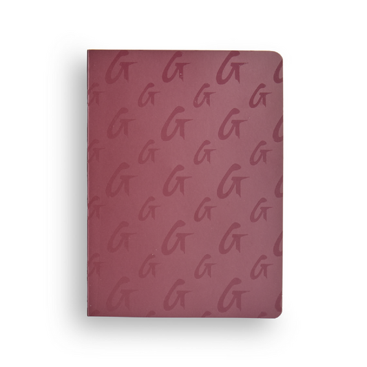 Burgundy monogram notebook featuring a repeating logo pattern, perfect for stylish note-taking.