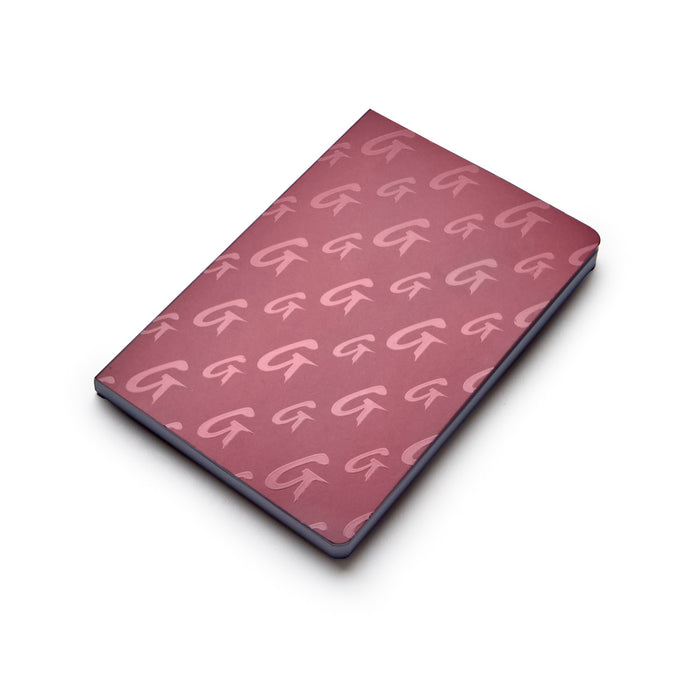 Burgundy notebook featuring a stylish monogram pattern, perfect for notes and journaling in luxury style.