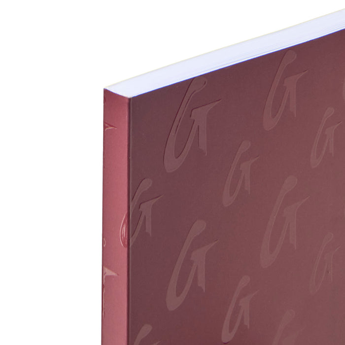 Burgundy monogram notebook featuring a sleek design, perfect for stylish note-taking and journaling.