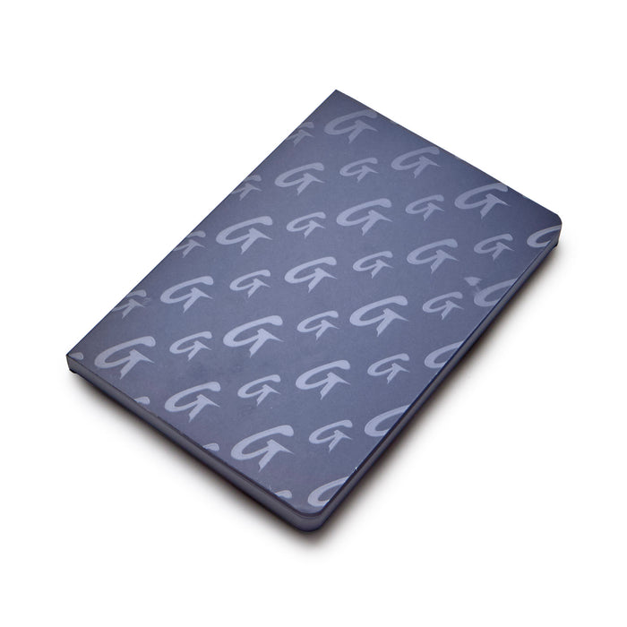 Navy monogram notebook featuring a stylish repeating logo pattern, perfect for elegant note-taking.