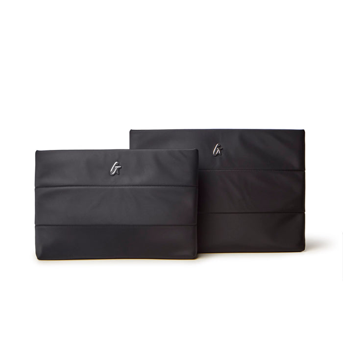 Sleek black nylon laptop sleeves in two sizes, designed for stylish protection of your devices.