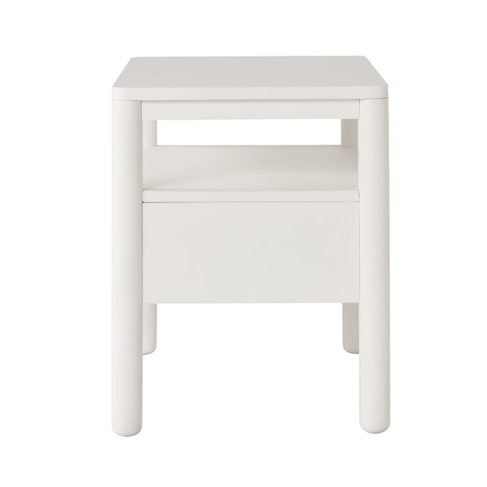 The Spintara 1 Drawer Bedside Table White, shown against a plain white background, features a coastal country style with rounded legs, an open shelf, and a lower drawer.