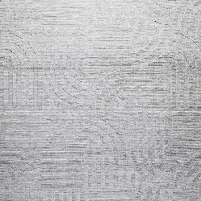 The Tufted Teal Jules Rug 300x240cm features a subtle geometric pattern of curved and straight lines, arranged symmetrically in a Mid-Century inspired design. The textured surface adds visual interest to any space.